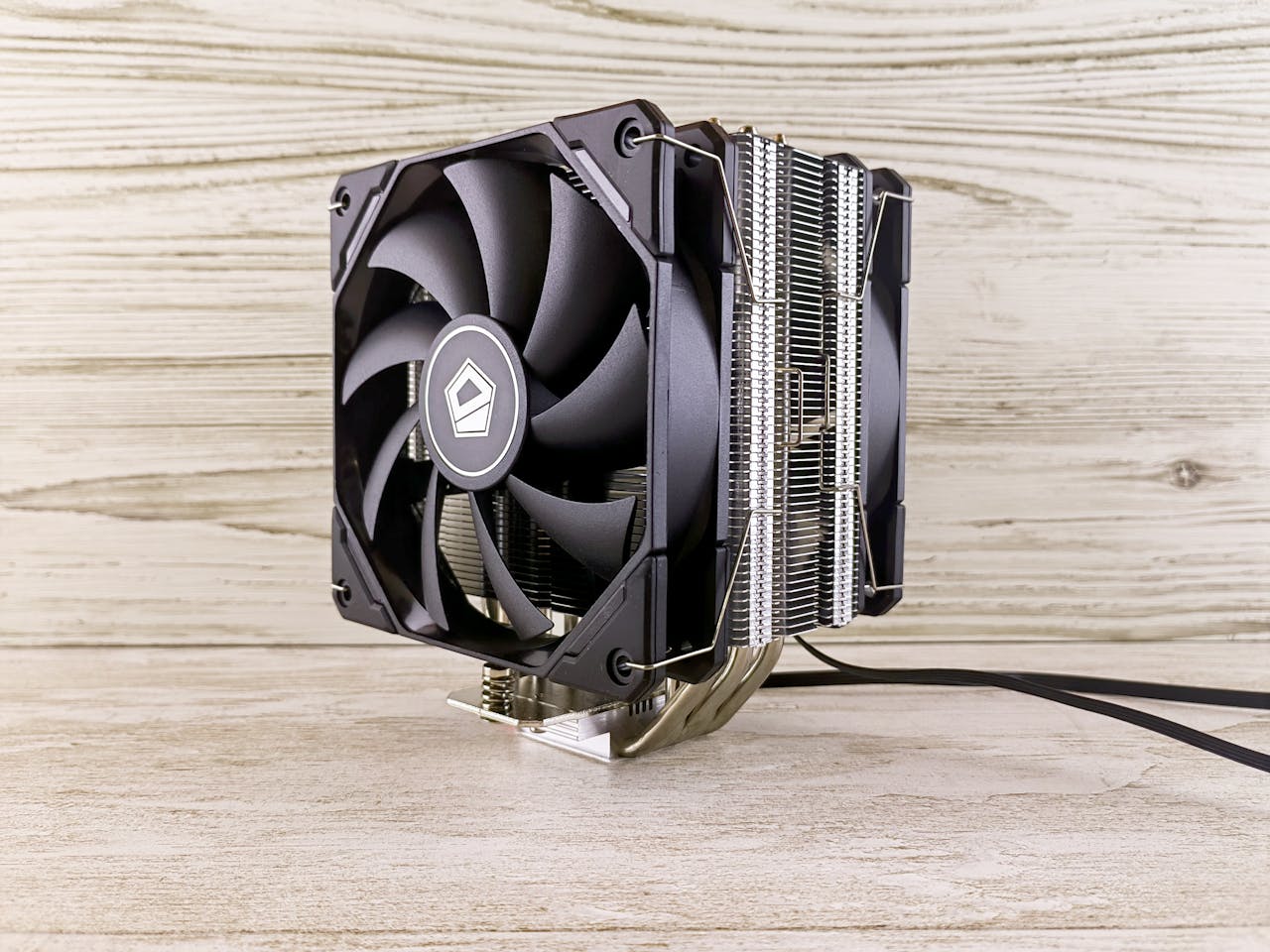 Close-up of a dual fan heatsink CPU cooler, ideal for computer builds.